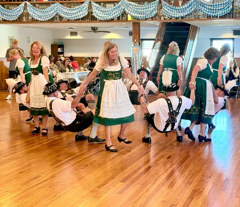 A group performing a coordinated traditional dance