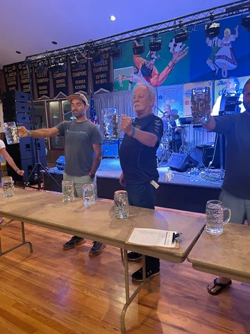 Guests taking part in a stein-hoisting competition