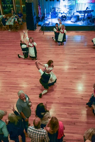 Dancers finishing a performance watched by the crowd