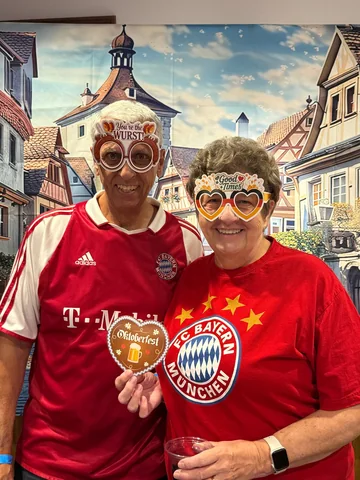 Two guests wearing festive photo props