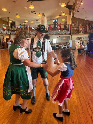 Adults and children sharing a dance