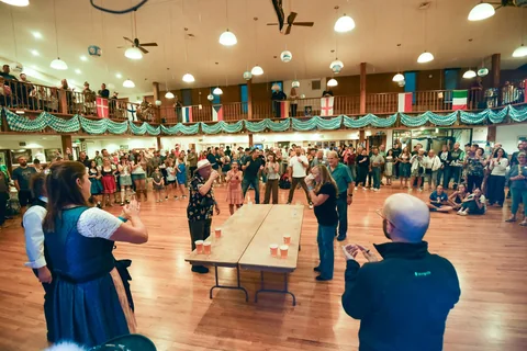 Contestants and spectators gathered around the relay table