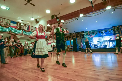 A dancing pair in traditional Bavarian clothing