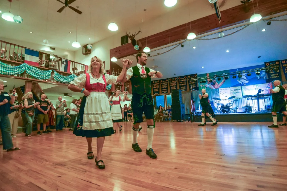 A dancing pair in traditional Bavarian clothing