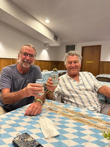 Two guests enjoying the celebration at a table