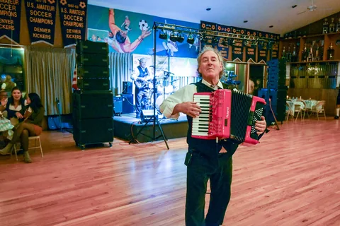 An accordion player entertaining guests on the dance floor