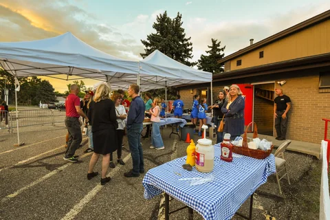 Guests gathering at the outdoor food-service area