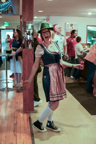 A guest in a dirndl and Alpine hat