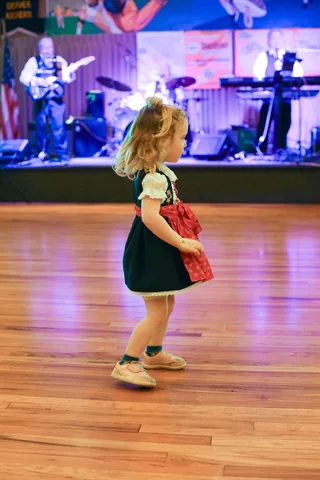 A young guest dancing near the stage